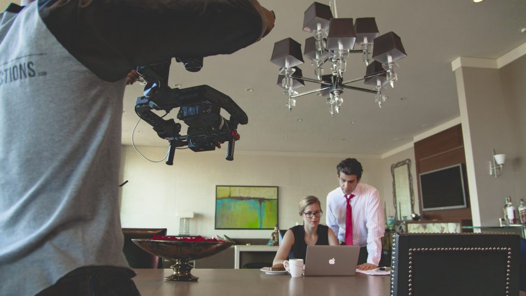 tv commercial being photographed with man and woman actors