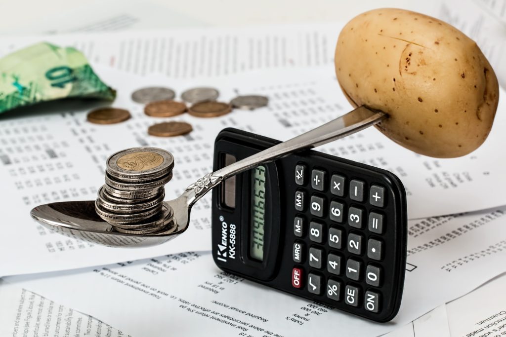 spoon balancing on calculator