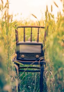 chair in field with radio on it